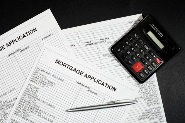 Mortgage application forms with a calculator and pen, the image iTnews ran with the article