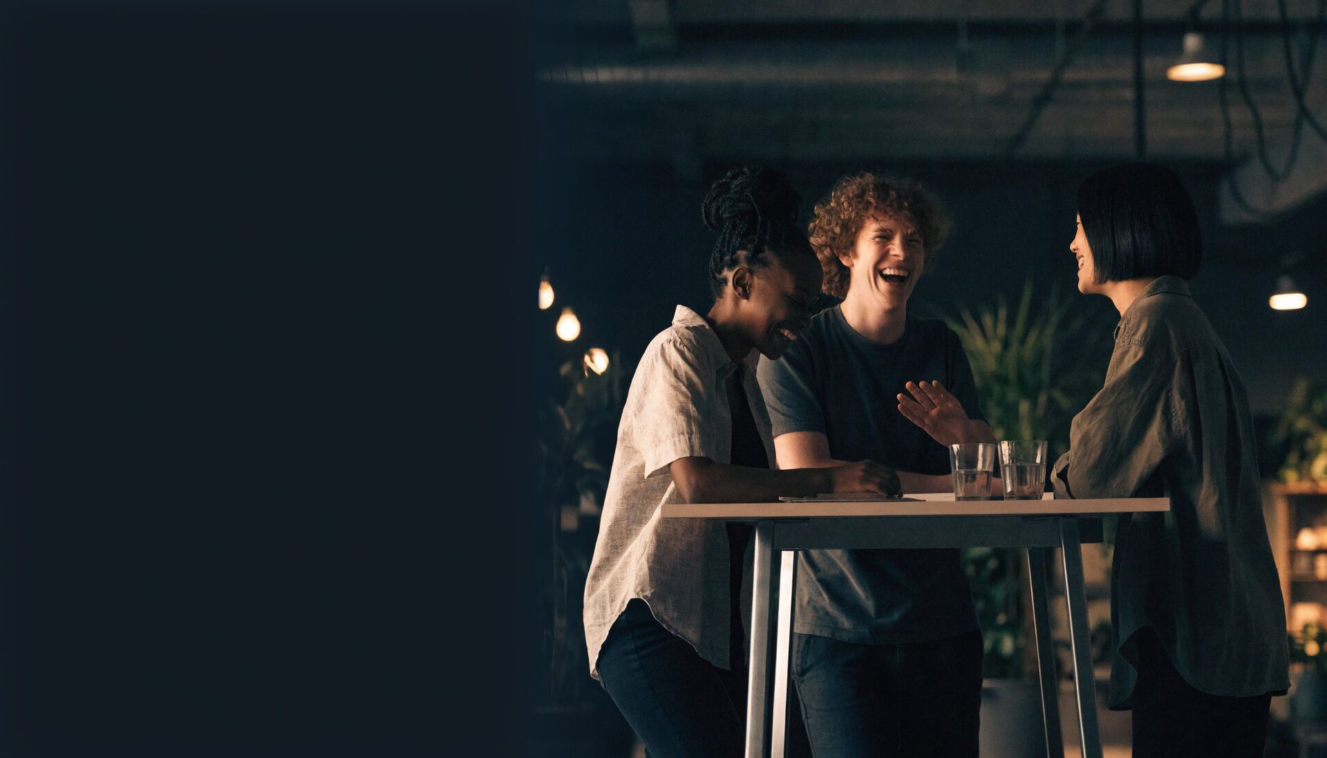 The Icana team laughing together around a table